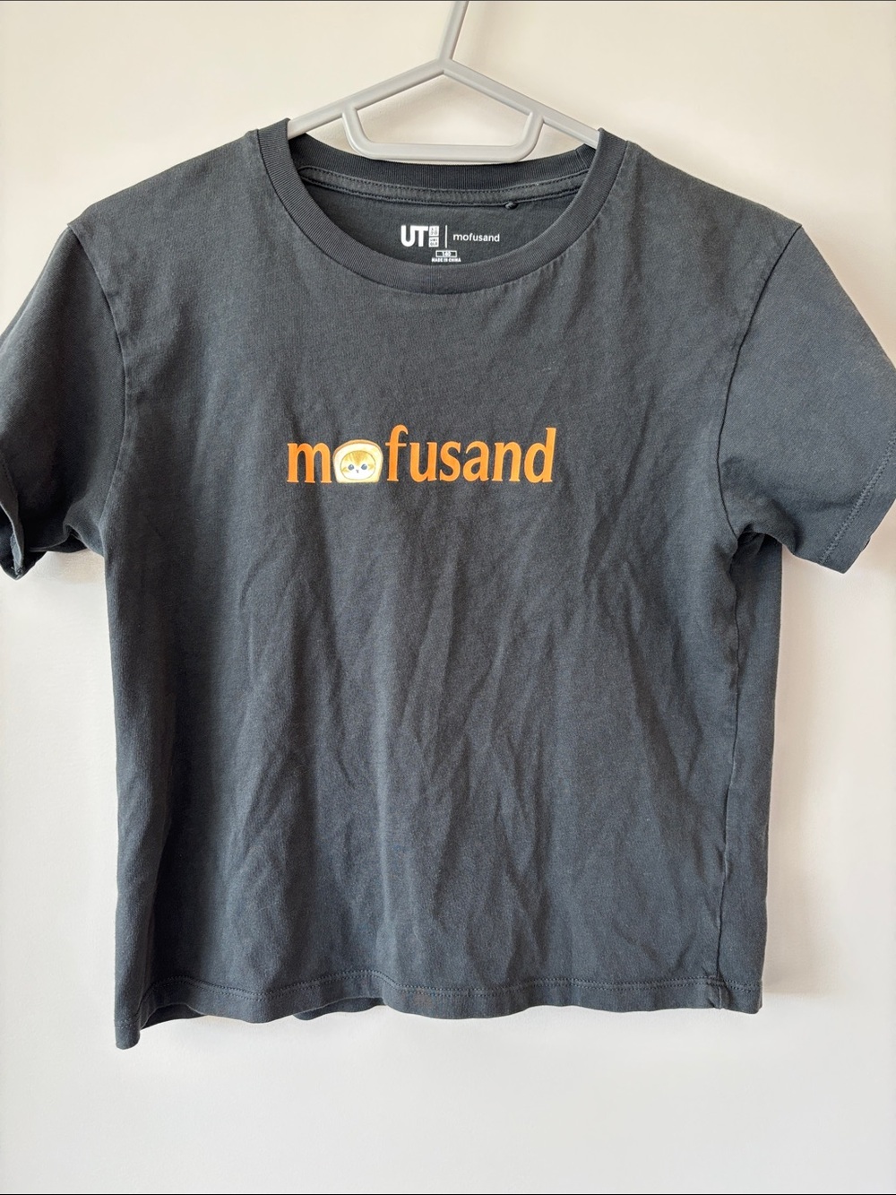 Uniqlo Black Short Sleeve Tee with Orange 'mofsund' Logo
